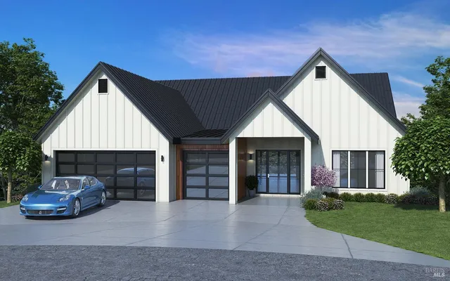 a view of a house with a yard and garage