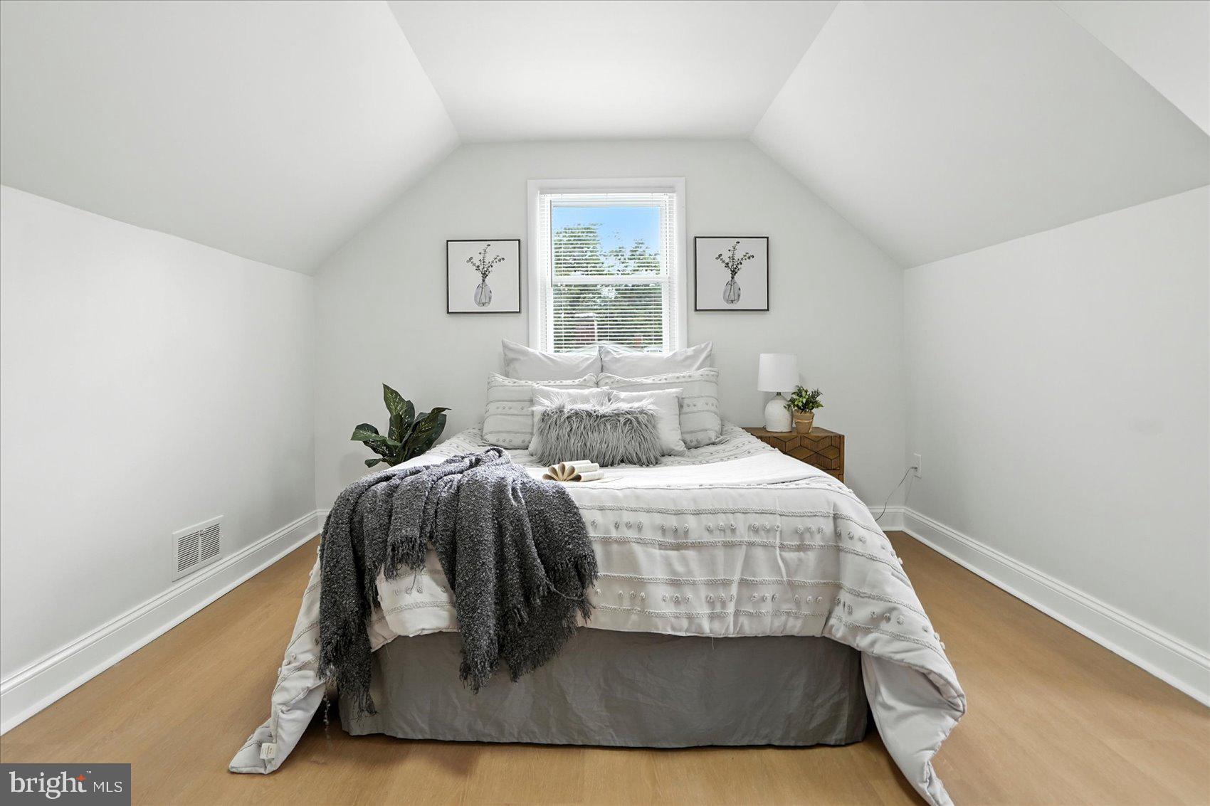 7031 Glen Spring Road Baltimore, MD 21244 - Photo 17 of 43 a bedroom with a bed and window