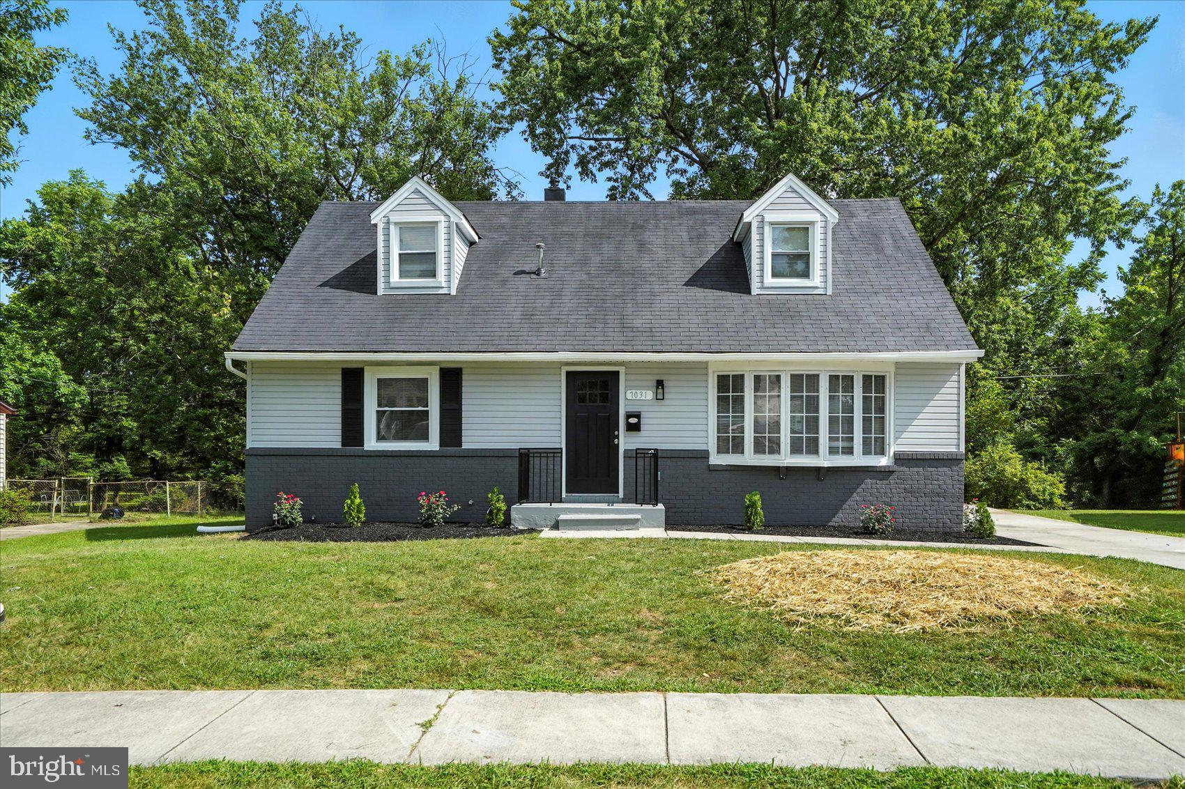 7031 Glen Spring Road Baltimore, MD 21244 - Photo 2 of 43 a front view of a house with a yard