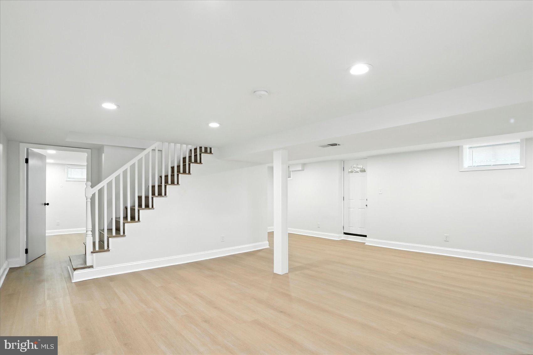 7031 Glen Spring Road Baltimore, MD 21244 - Photo 30 of 43 a view of an empty room with wooden floor