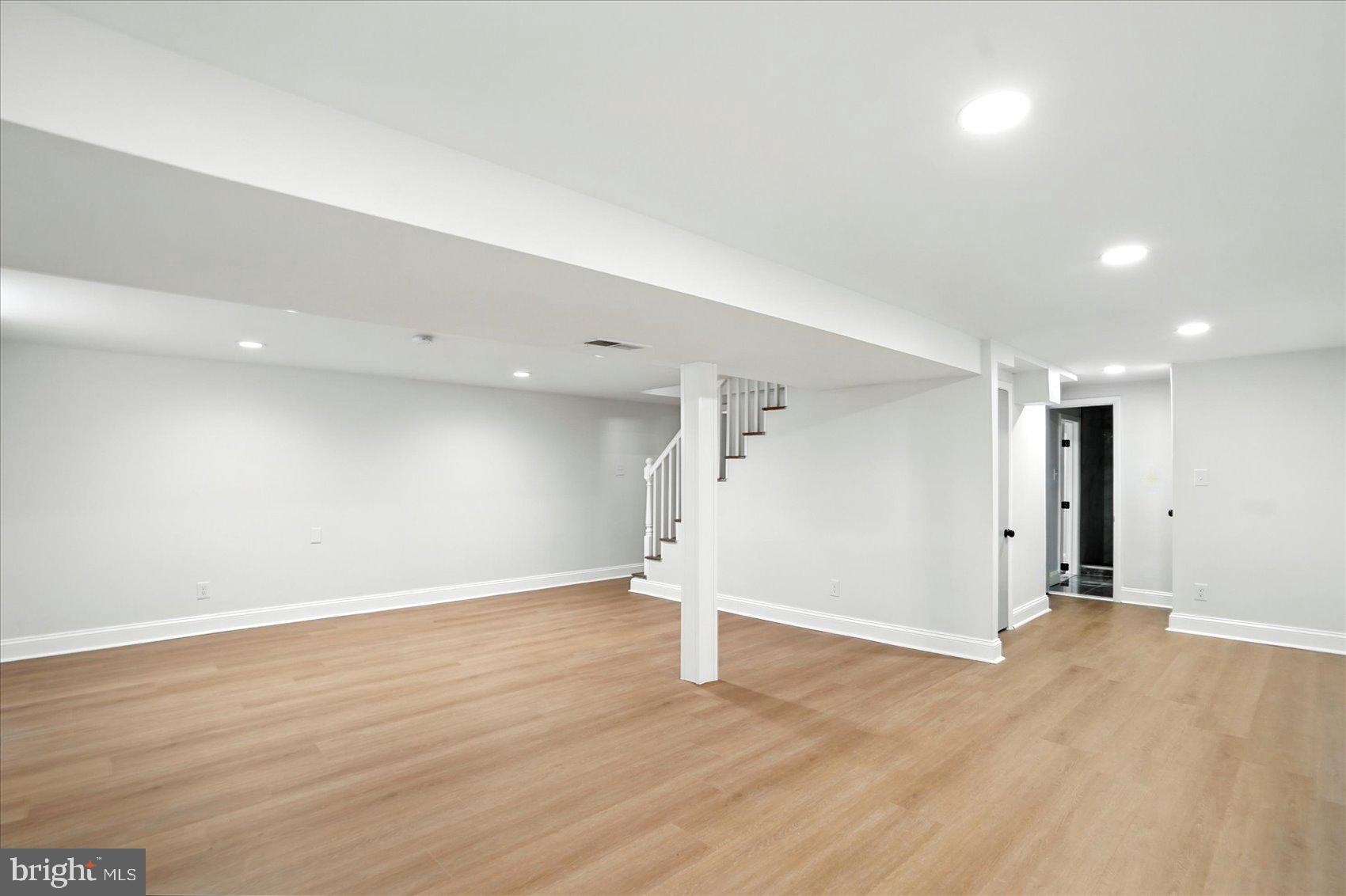 7031 Glen Spring Road Baltimore, MD 21244 - Photo 31 of 43 a view of empty room with wooden floor