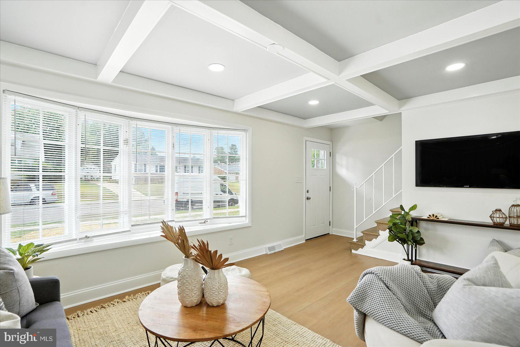 7031 Glen Spring Road Baltimore, MD 21244 - Photo 5 of 43 a living room with furniture and a flat screen tv
