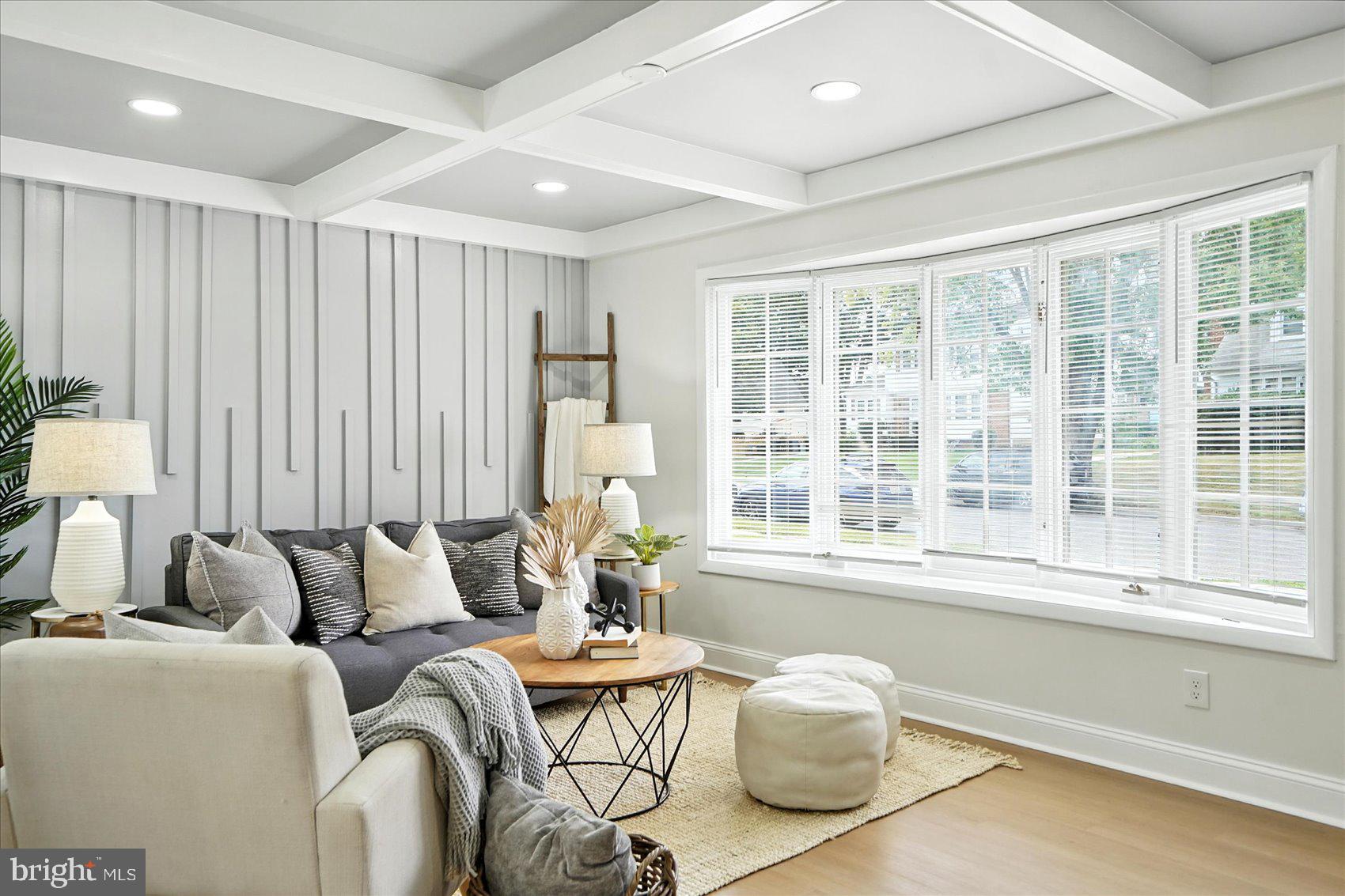 7031 Glen Spring Road Baltimore, MD 21244 - Photo 7 of 43 a living room with furniture and large windows