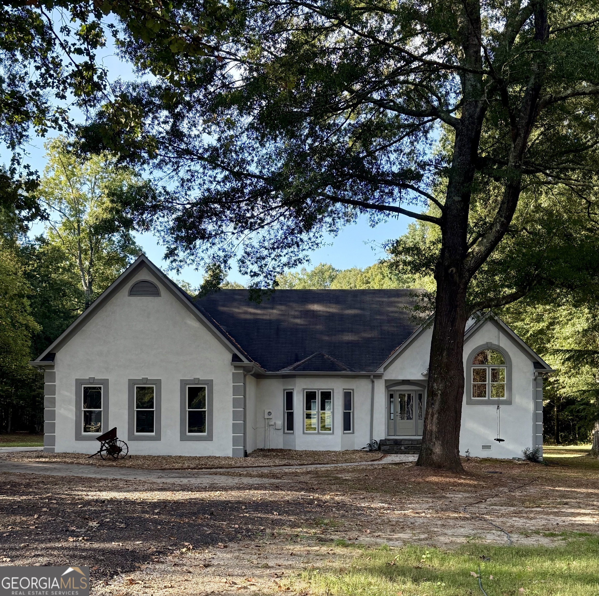 5120 Blanton Mill Road Williamson, GA 30292 - Photo 1 of 1 a front view of a house with a yard