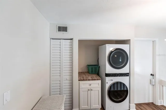 a view of a hallway with washer and dryer