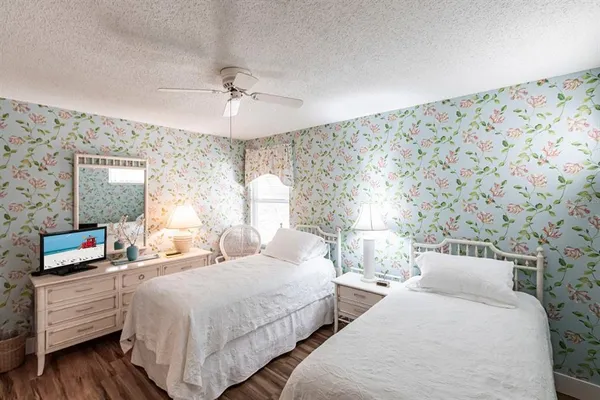 a bedroom with double bed and a flat screen tv