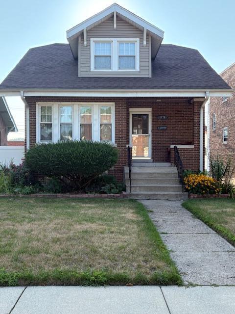 1726 Davis Avenue Whiting, IN 46394 - Photo 1 of 40 a front view of a house with garden