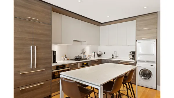 a kitchen with a stove a sink and a refrigerator