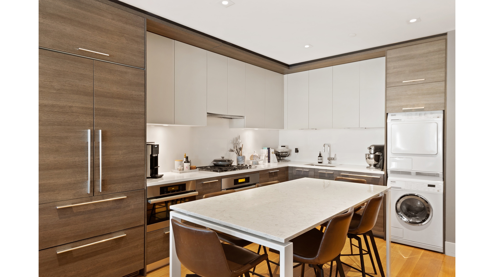 a kitchen with a stove a sink and a refrigerator