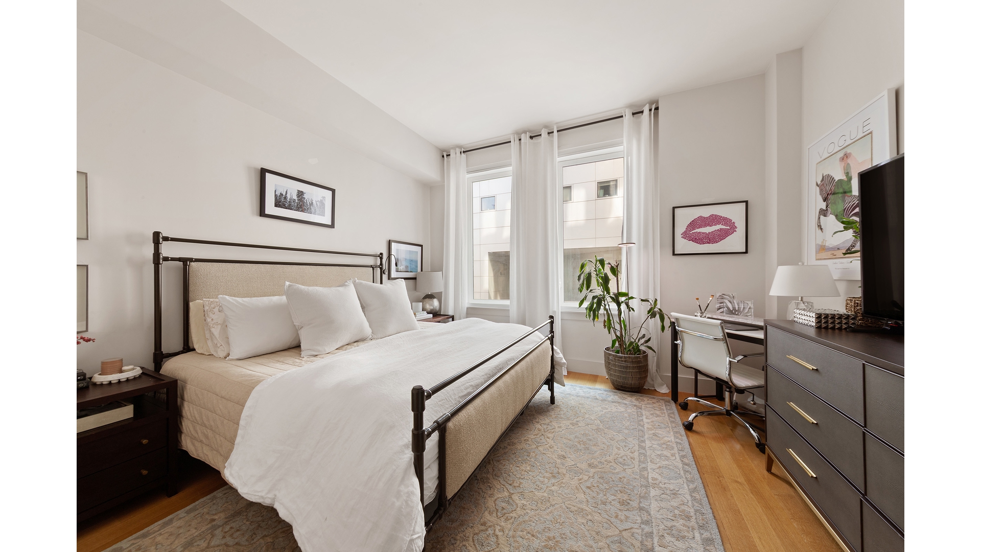 101 Leonard Street, Unit 5F Manhattan, NY 10013 - Photo 6 of 9 a bed room with a bed tv and a window