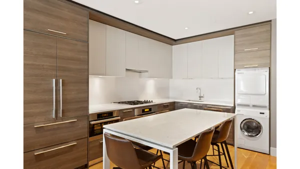 a kitchen with a stove a sink and a refrigerator