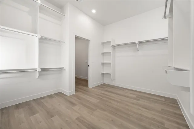 an empty room with wooden floor