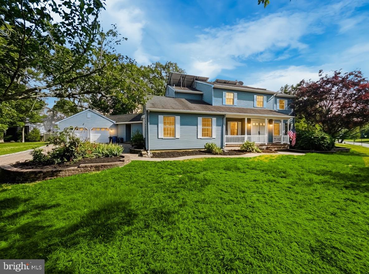 705 Princeton Road Lanoka Harbor, NJ 08734 - Photo 1 of 141 a front view of house with yard and green space