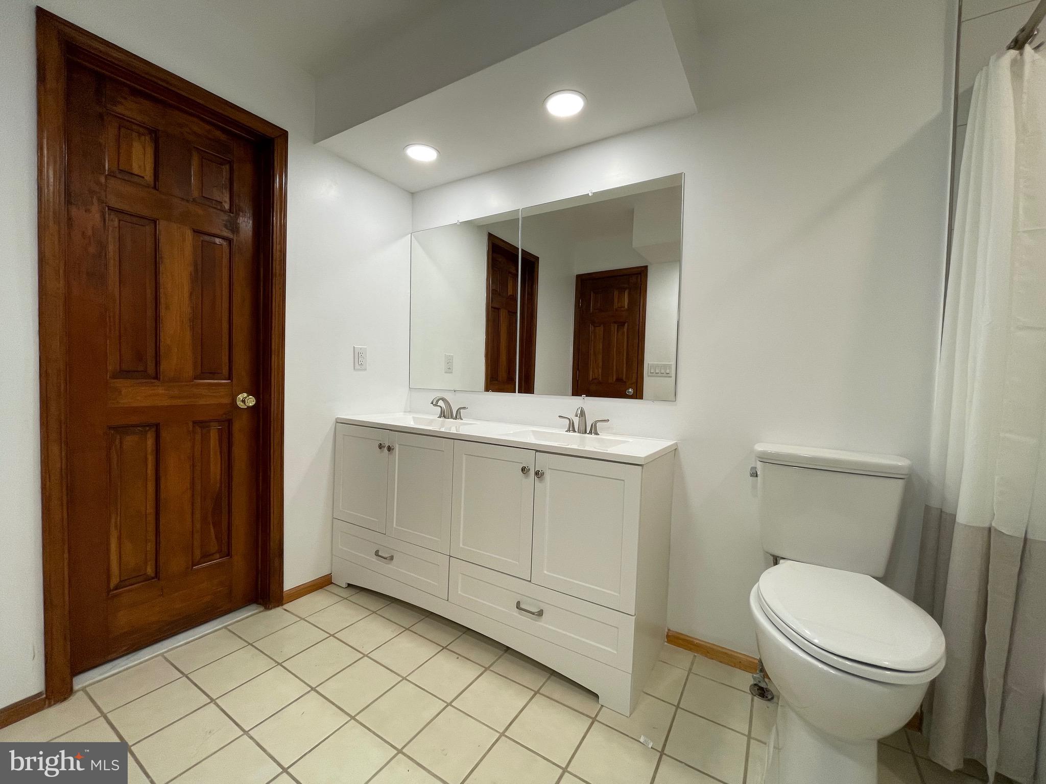 705 Princeton Road Lanoka Harbor, NJ 08734 - Photo 104 of 141 a bathroom with a sink a toilet and mirror