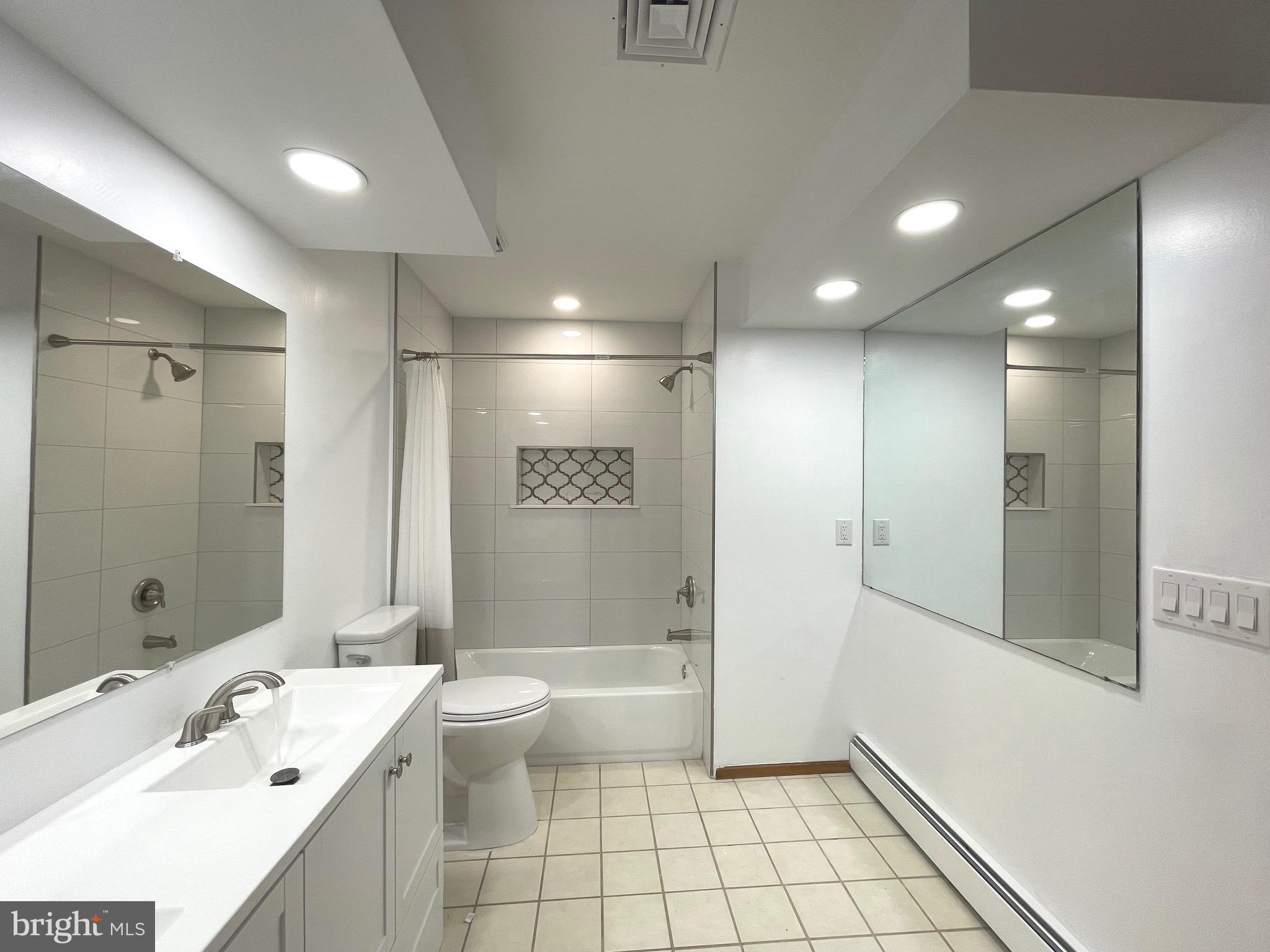 705 Princeton Road Lanoka Harbor, NJ 08734 - Photo 105 of 141 a bathroom with a bathtub shower sink mirror and toilet