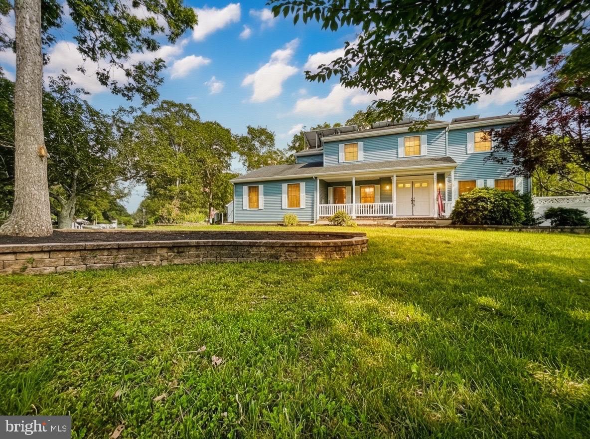 705 Princeton Road Lanoka Harbor, NJ 08734 - Photo 11 of 141 a front view of a house with a yard