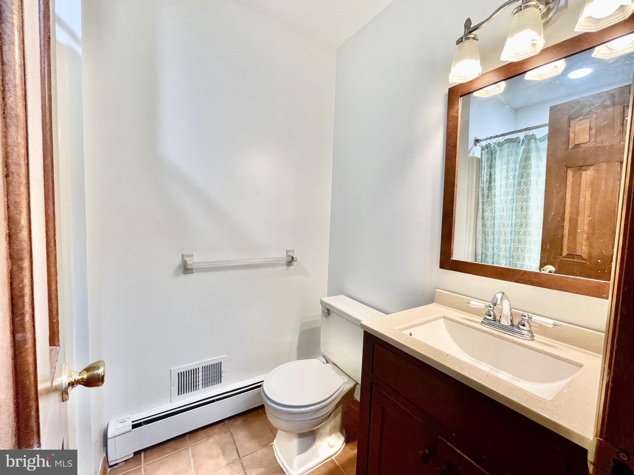 705 Princeton Road Lanoka Harbor, NJ 08734 - Photo 121 of 141 a bathroom with a sink toilet vanity and shower