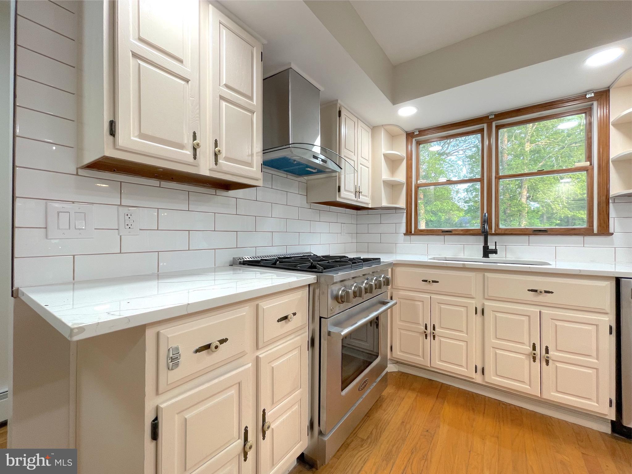 705 Princeton Road Lanoka Harbor, NJ 08734 - Photo 13 of 141 a kitchen with stainless steel appliances granite countertop a sink a stove and cabinets