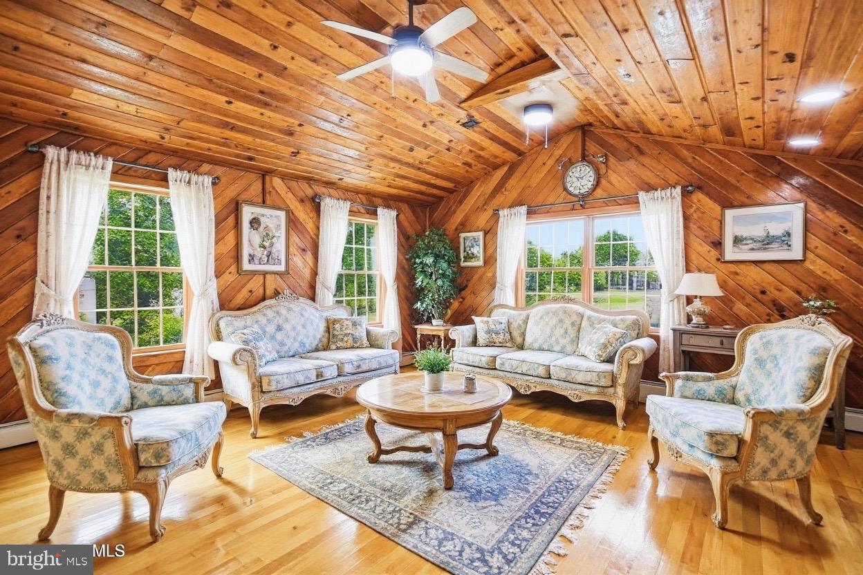 705 Princeton Road Lanoka Harbor, NJ 08734 - Photo 14 of 141 a living room with furniture a table and a potted plant