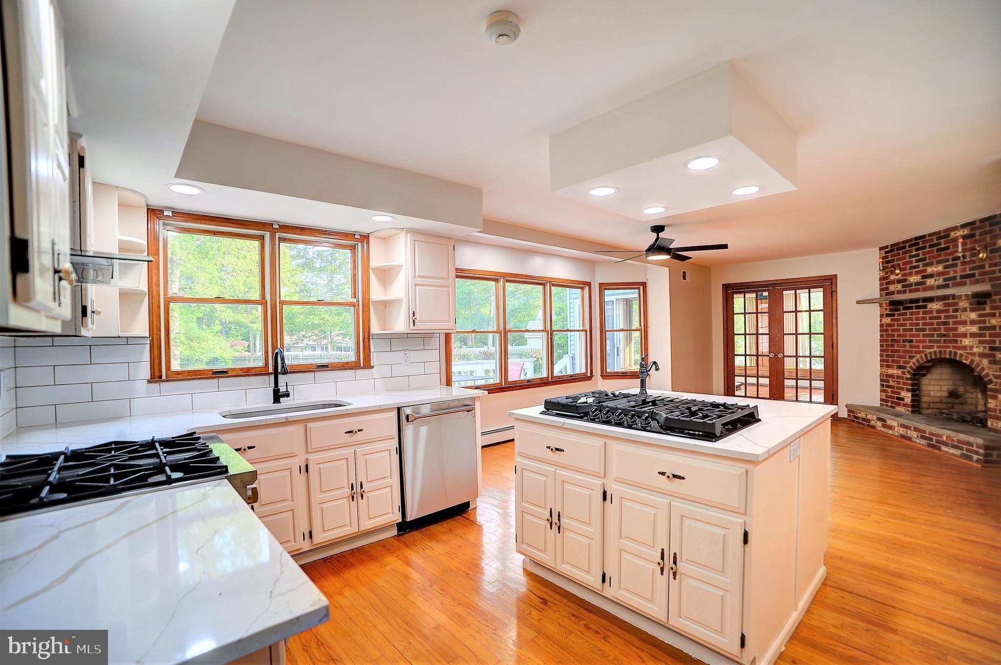 705 Princeton Road Lanoka Harbor, NJ 08734 - Photo 28 of 141 a kitchen with a stove a sink and a refrigerator