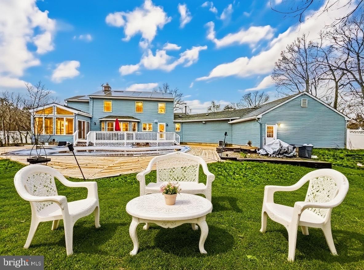 705 Princeton Road Lanoka Harbor, NJ 08734 - Photo 6 of 141 a balcony with table and chairs