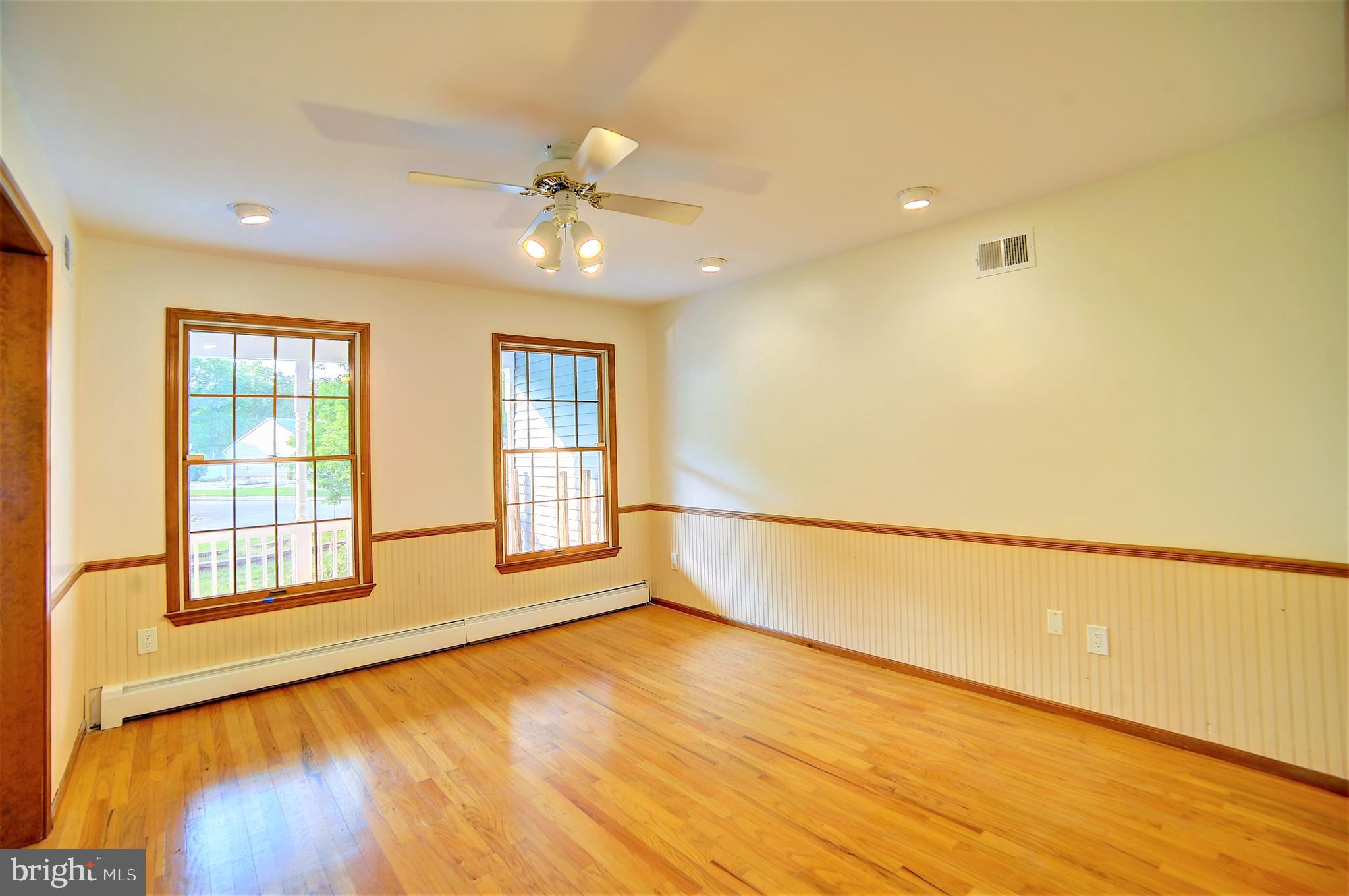 705 Princeton Road Lanoka Harbor, NJ 08734 - Photo 61 of 141 a view of an empty room with a window and wooden floor
