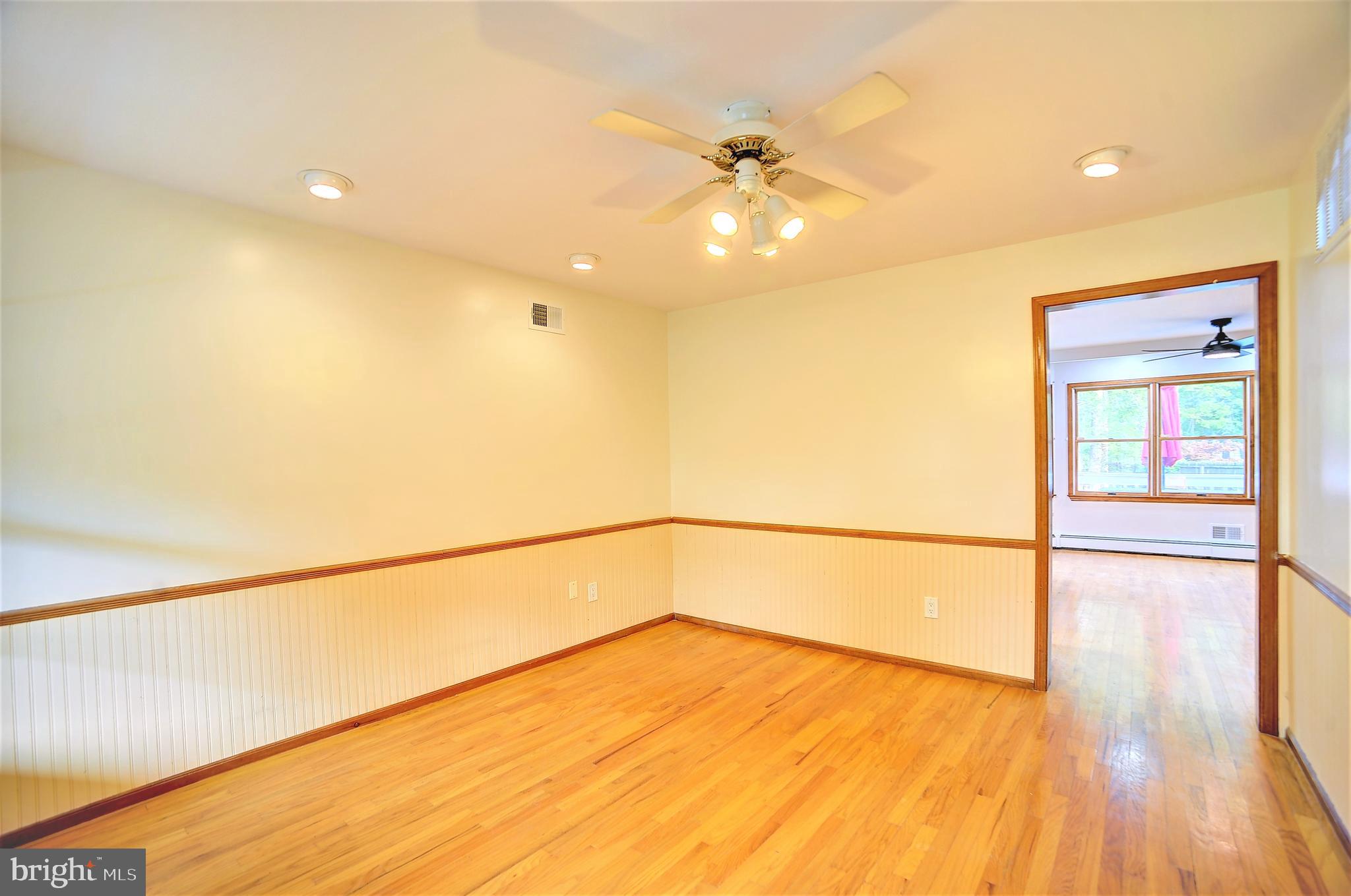 705 Princeton Road Lanoka Harbor, NJ 08734 - Photo 63 of 141 a view of an empty room with wooden floor