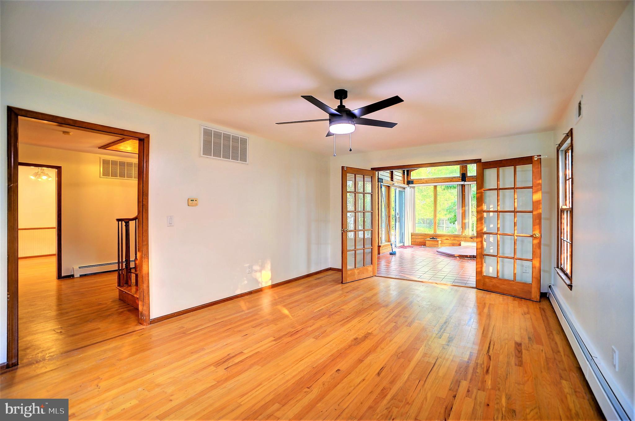 705 Princeton Road Lanoka Harbor, NJ 08734 - Photo 71 of 141 wooden floor in an empty room with a window