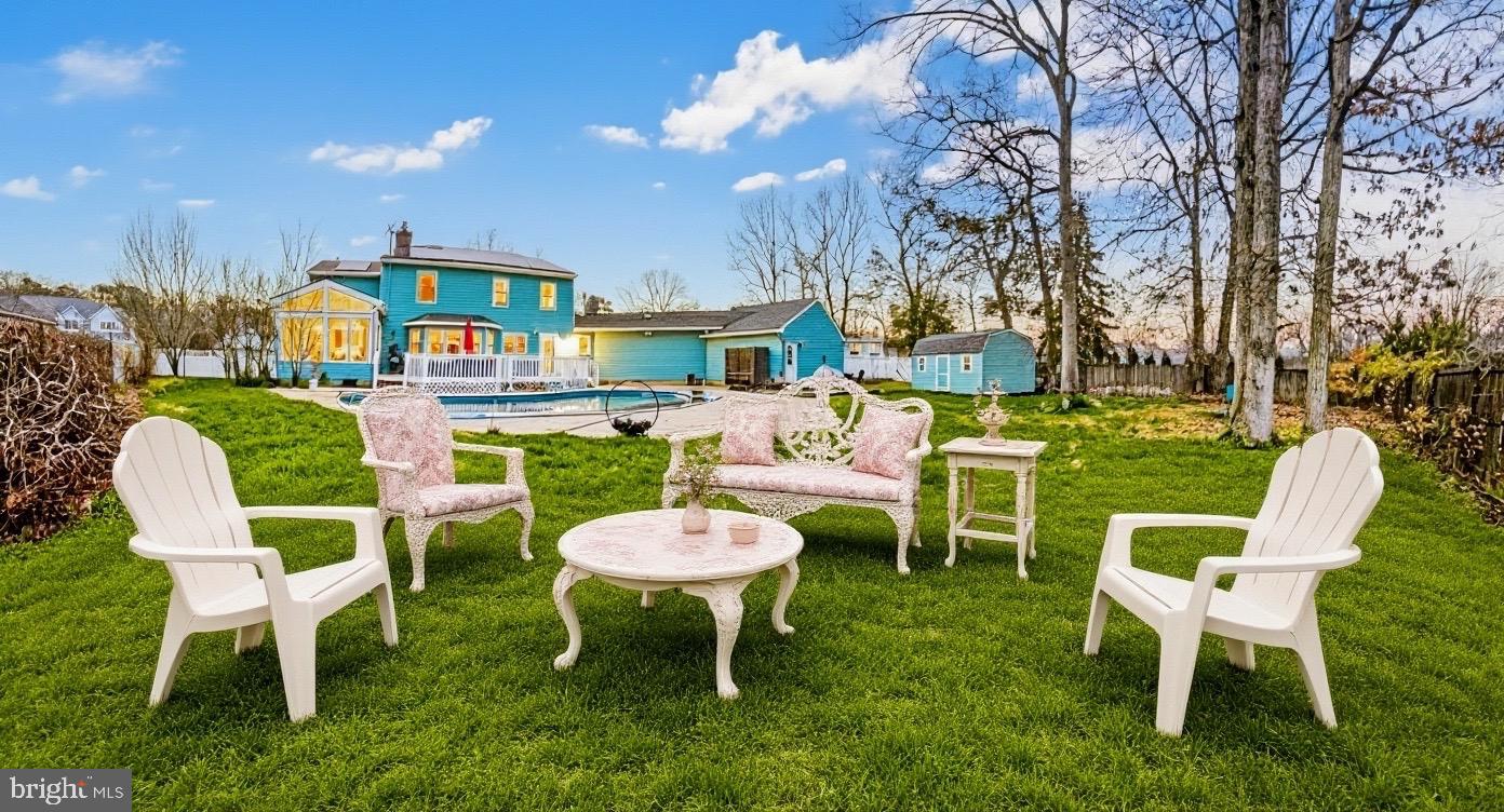 705 Princeton Road Lanoka Harbor, NJ 08734 - Photo 8 of 141 a table and chairs in a patio