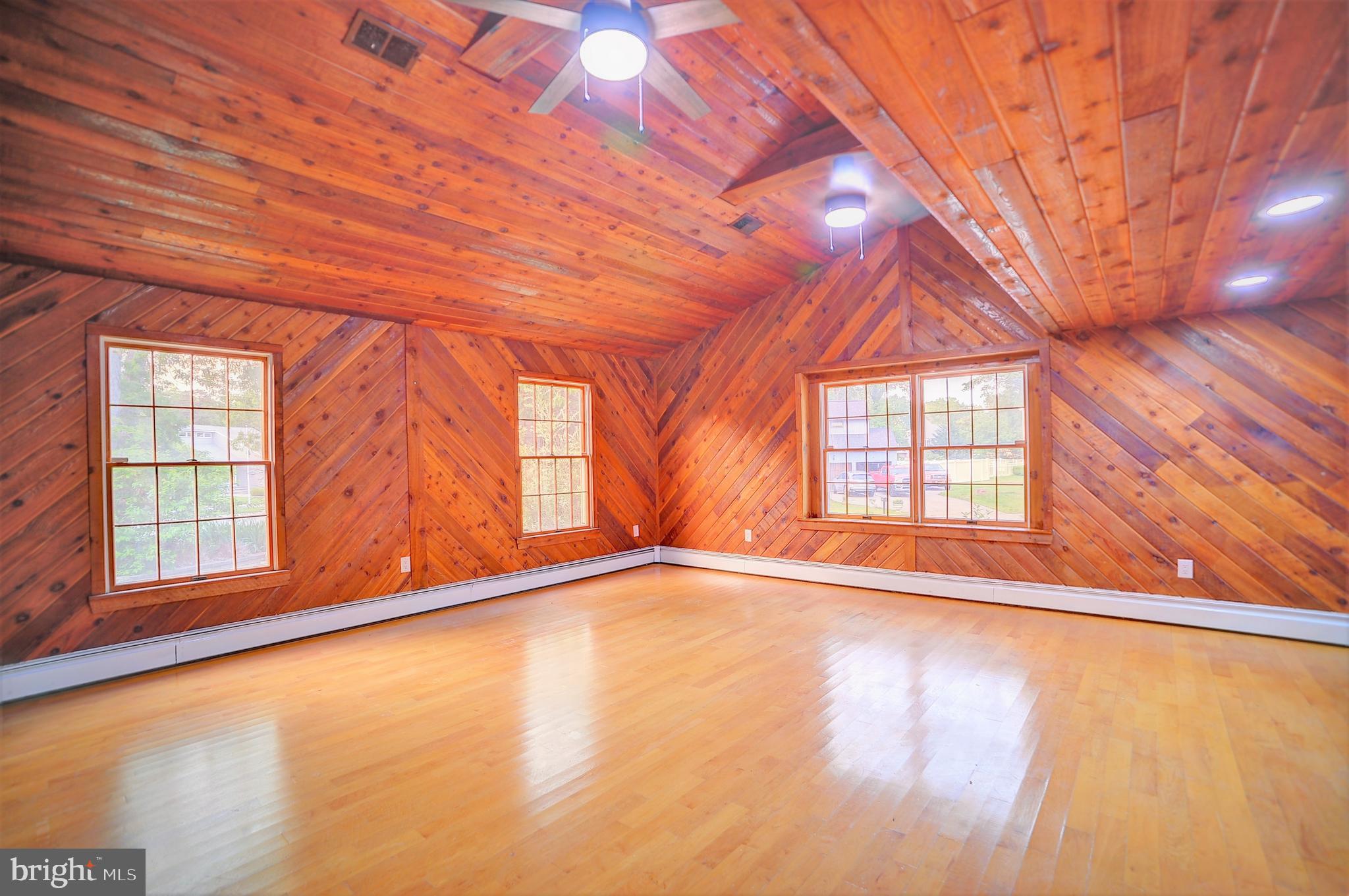 705 Princeton Road Lanoka Harbor, NJ 08734 - Photo 81 of 141 a view of an empty room with a window and wooden floor