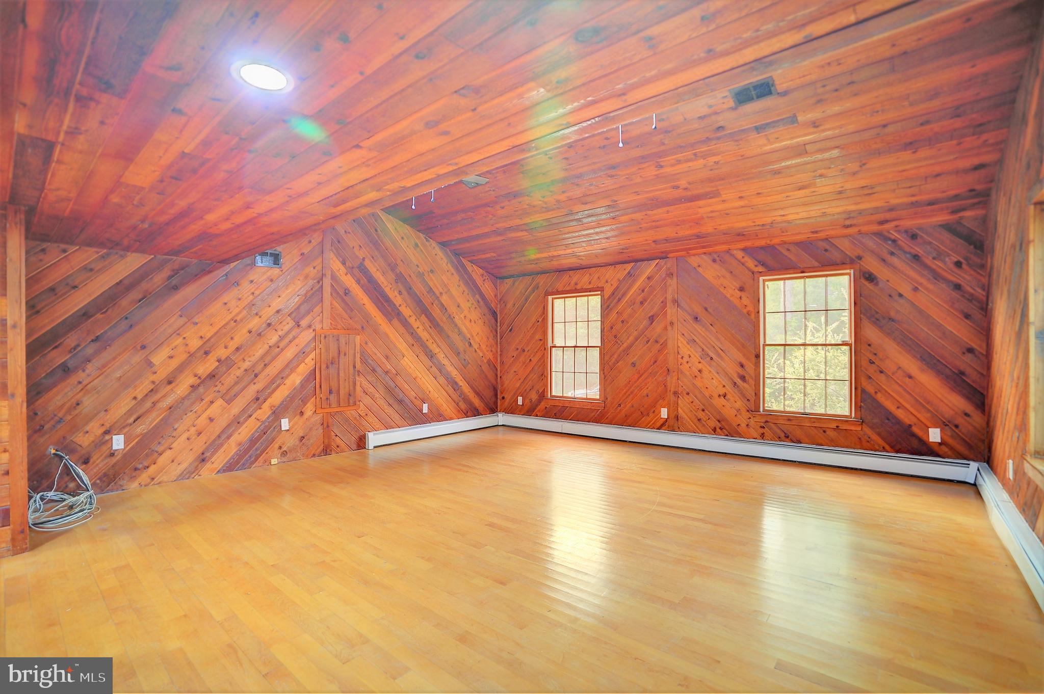 705 Princeton Road Lanoka Harbor, NJ 08734 - Photo 88 of 141 a view of an empty room with wooden floor and a window