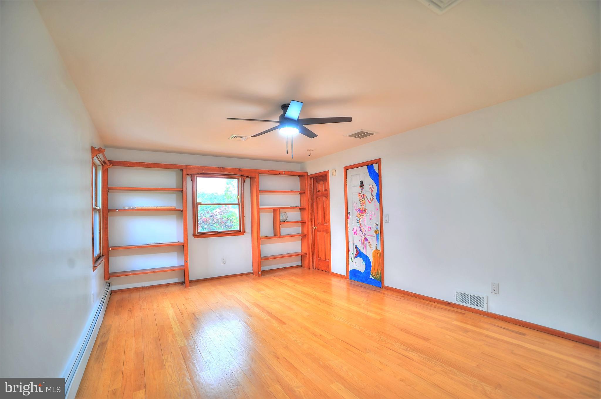 705 Princeton Road Lanoka Harbor, NJ 08734 - Photo 91 of 141 wooden floor in an empty room with a window