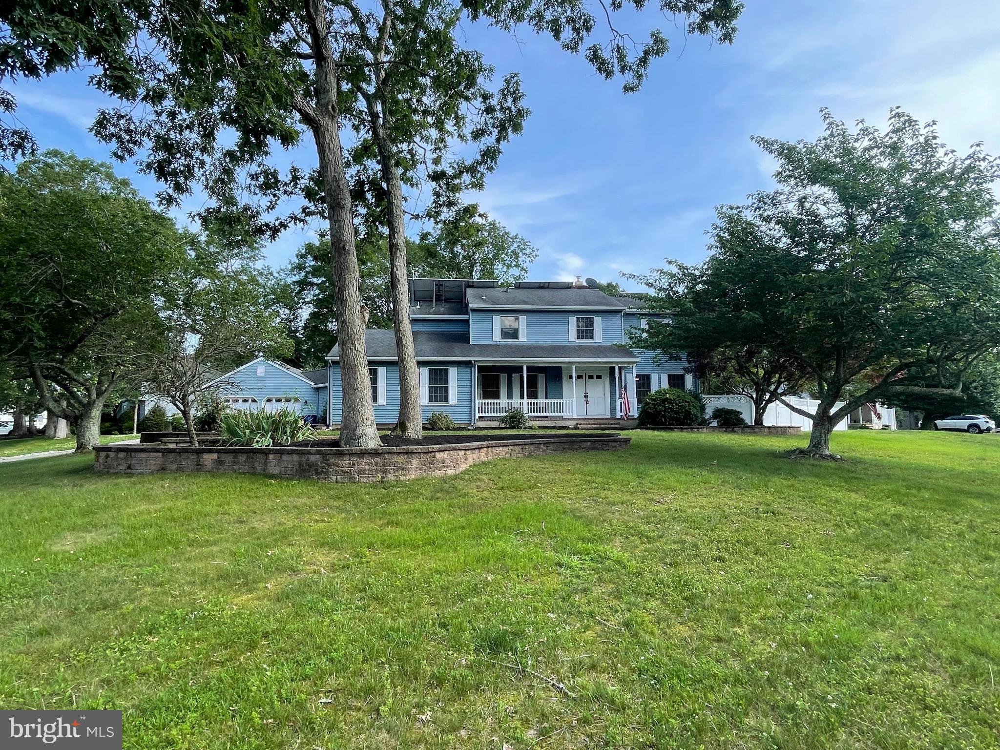 705 Princeton Road Lanoka Harbor, NJ 08734 - Photo 10 of 141 a view of a house with a big yard and large trees