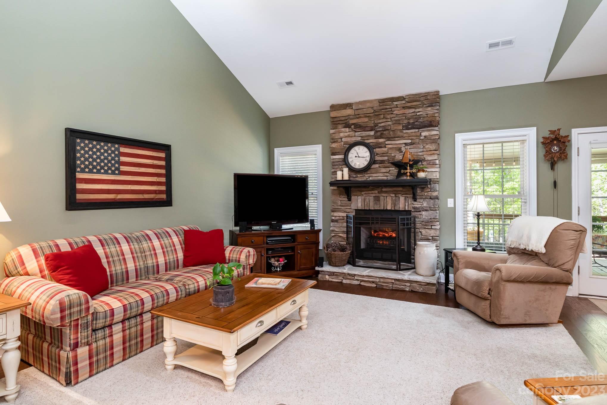 2255 South Paraham Road York, SC 29745 - Photo 11 of 33 a living room with furniture a flat screen tv and a fireplace