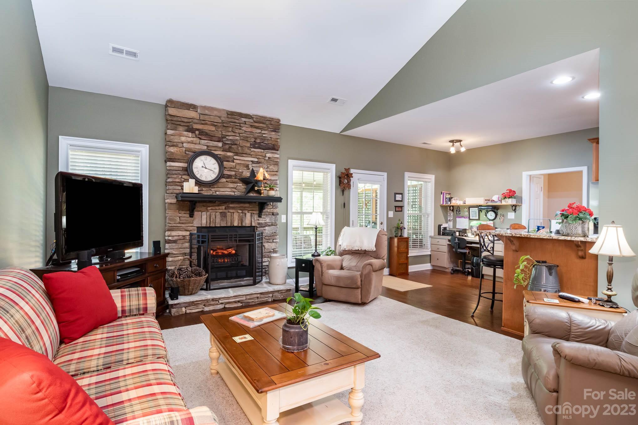 2255 South Paraham Road York, SC 29745 - Photo 13 of 33 a living room with furniture a flat screen tv and a fireplace