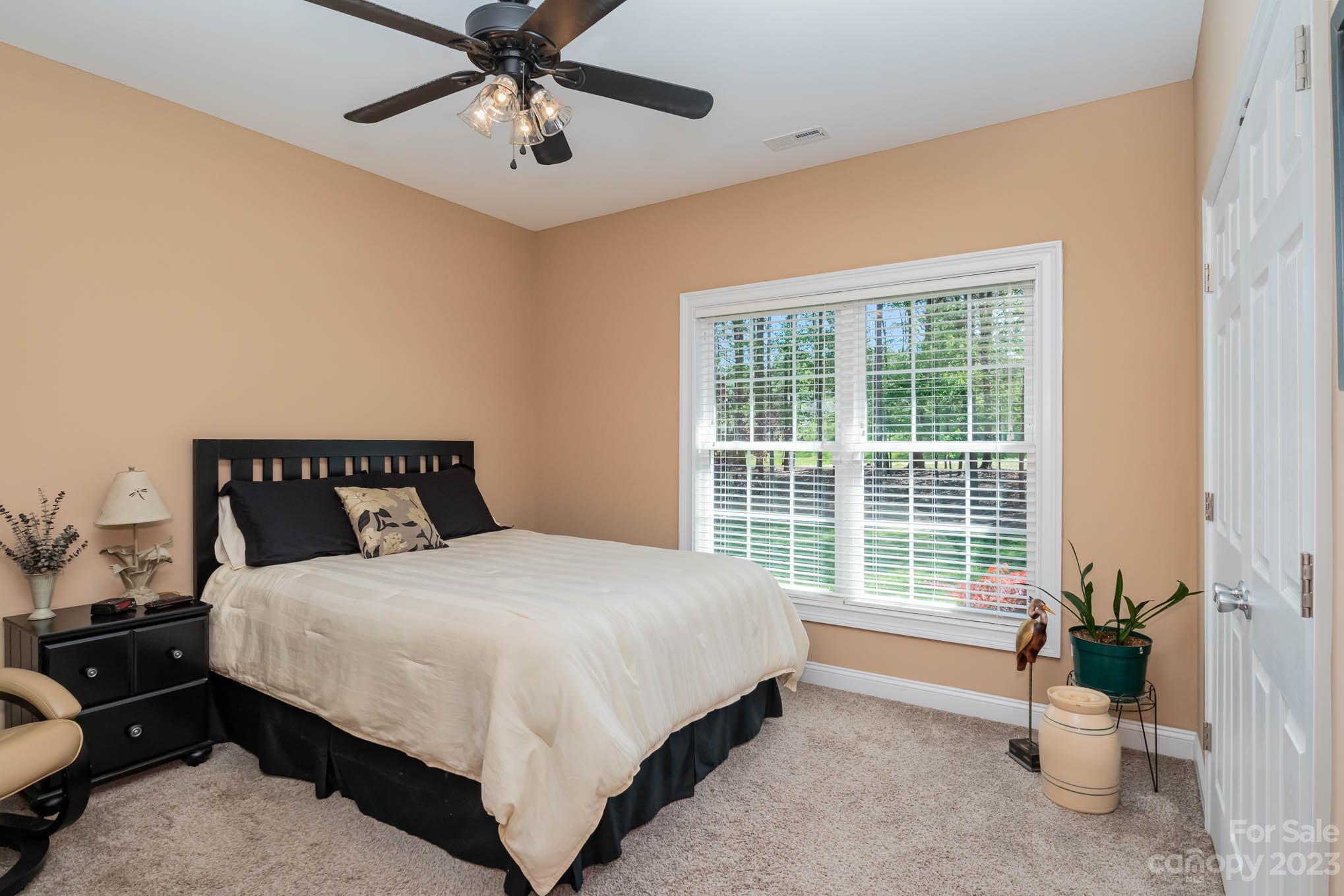2255 South Paraham Road York, SC 29745 - Photo 19 of 33 a bedroom with a bed and a chandelier