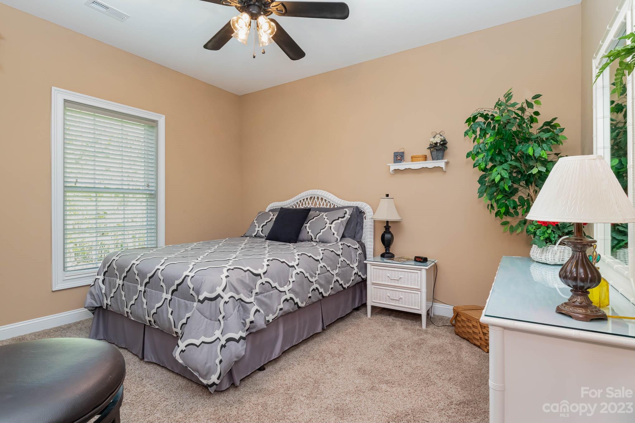 2255 South Paraham Road York, SC 29745 - Photo 20 of 33 a bedroom with a bed and a chandelier