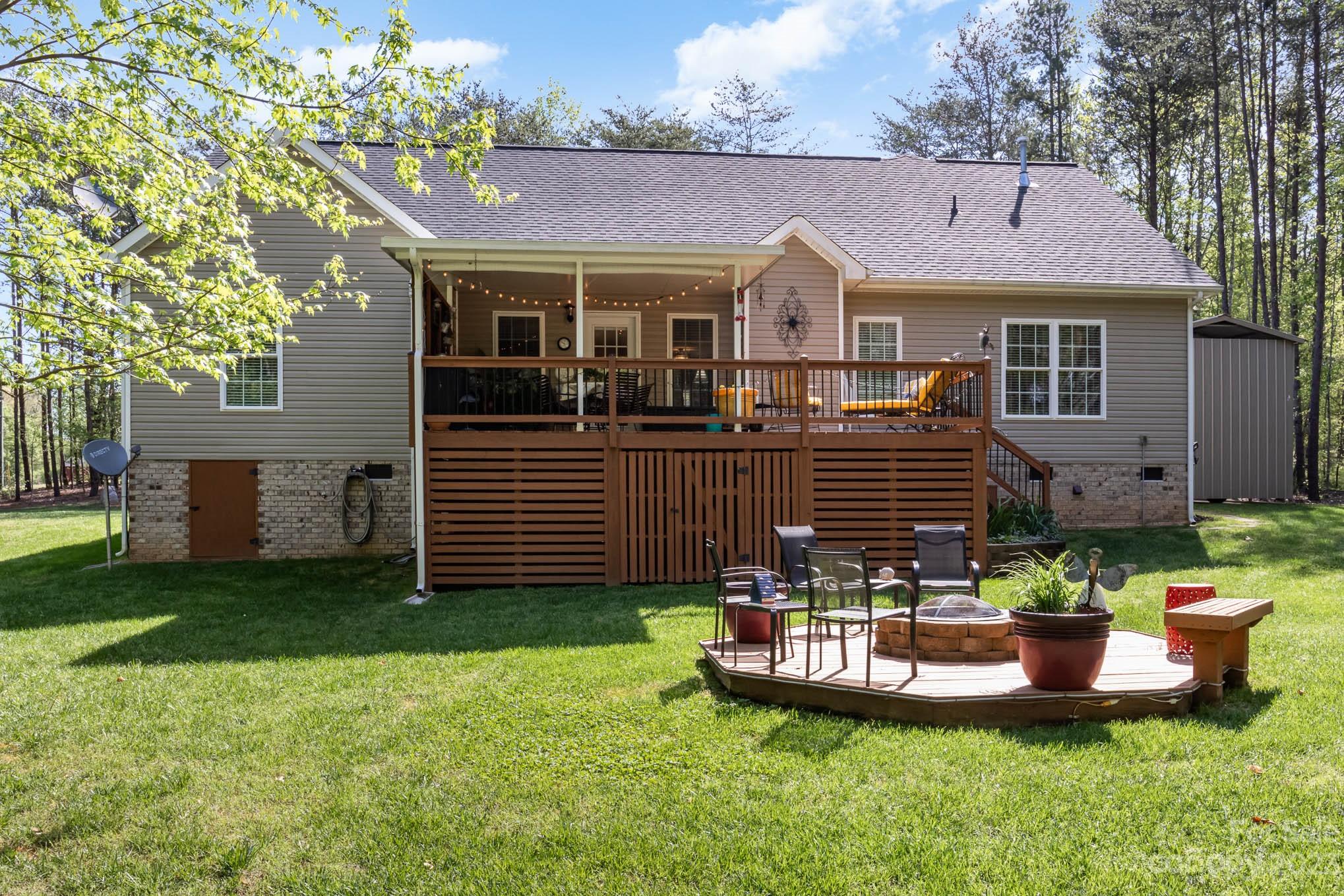 2255 South Paraham Road York, SC 29745 - Photo 27 of 33 a front view of a house with a garden and trees