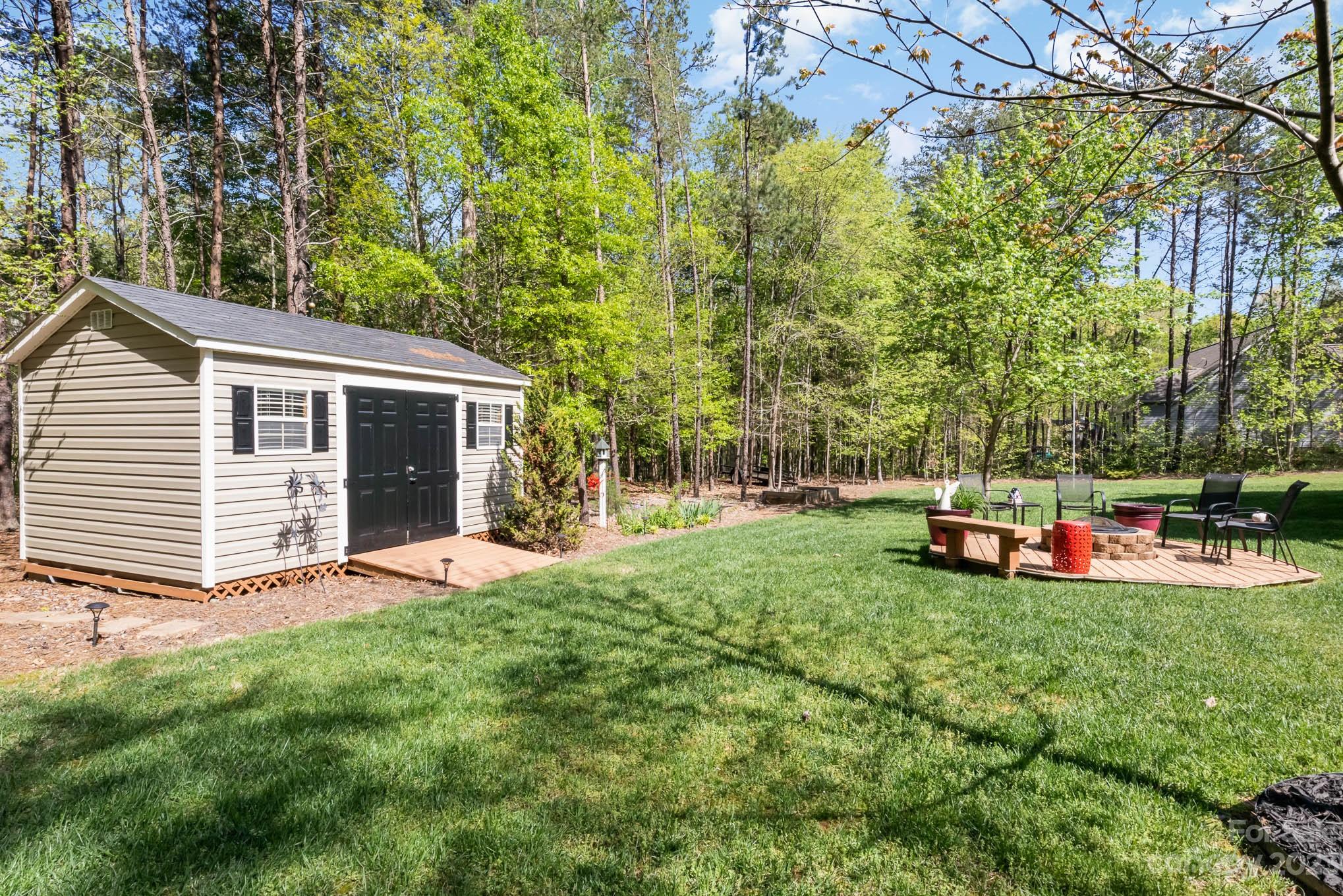 2255 South Paraham Road York, SC 29745 - Photo 29 of 33 a view of a house with backyard and sitting area