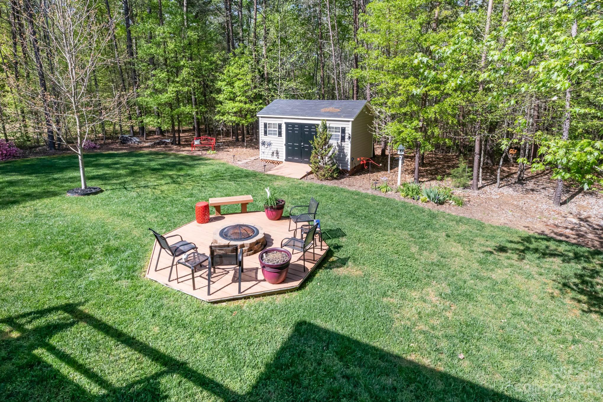 2255 South Paraham Road York, SC 29745 - Photo 32 of 33 a view of a house with a backyard and a patio