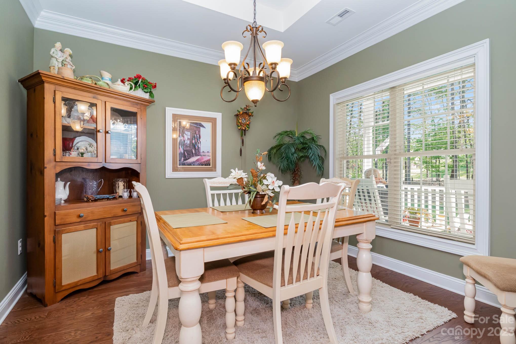 2255 South Paraham Road York, SC 29745 - Photo 5 of 33 a view of a dining room with furniture a chandelier and a window