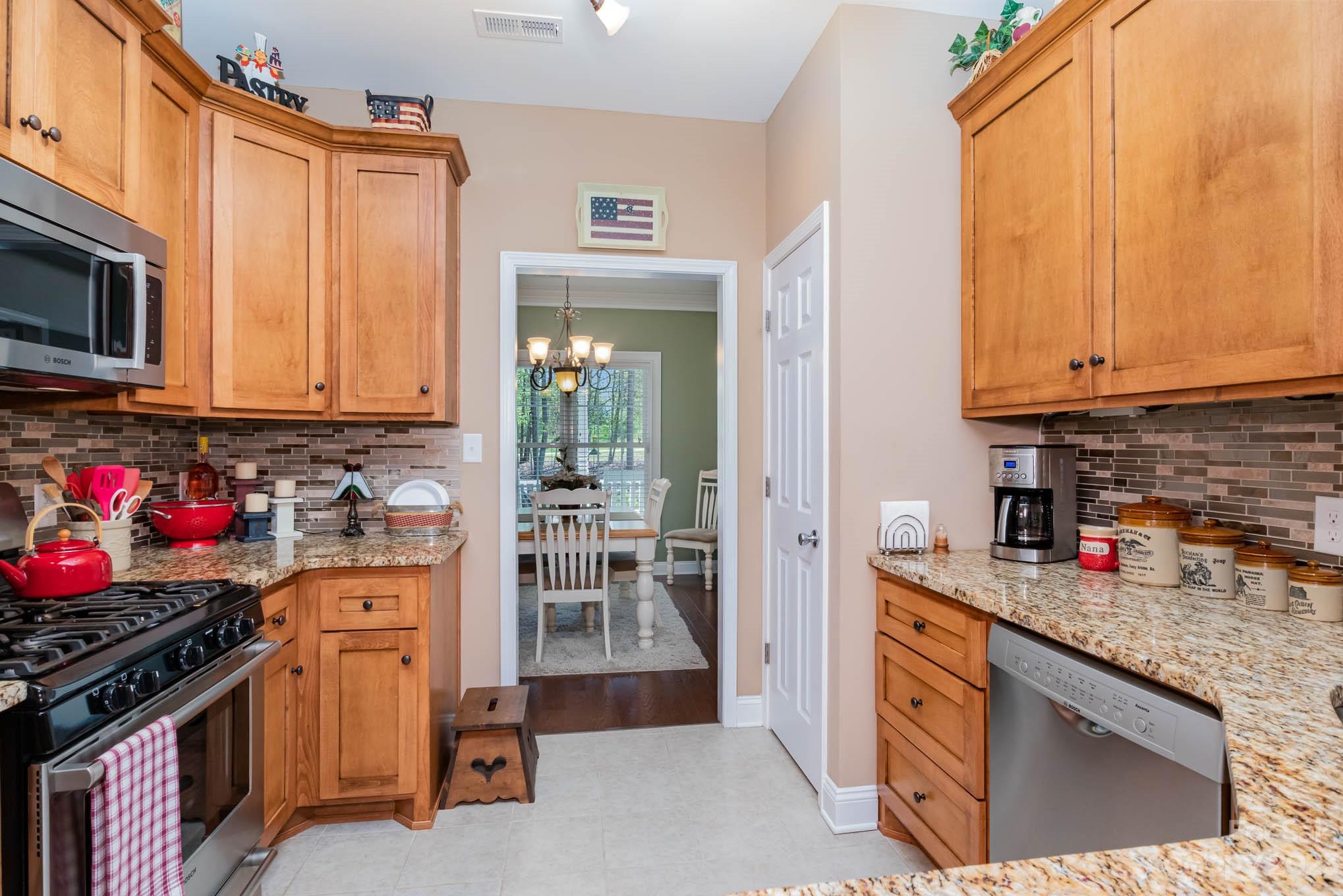 2255 South Paraham Road York, SC 29745 - Photo 6 of 33 a kitchen with stainless steel appliances granite countertop a stove a sink and a microwave