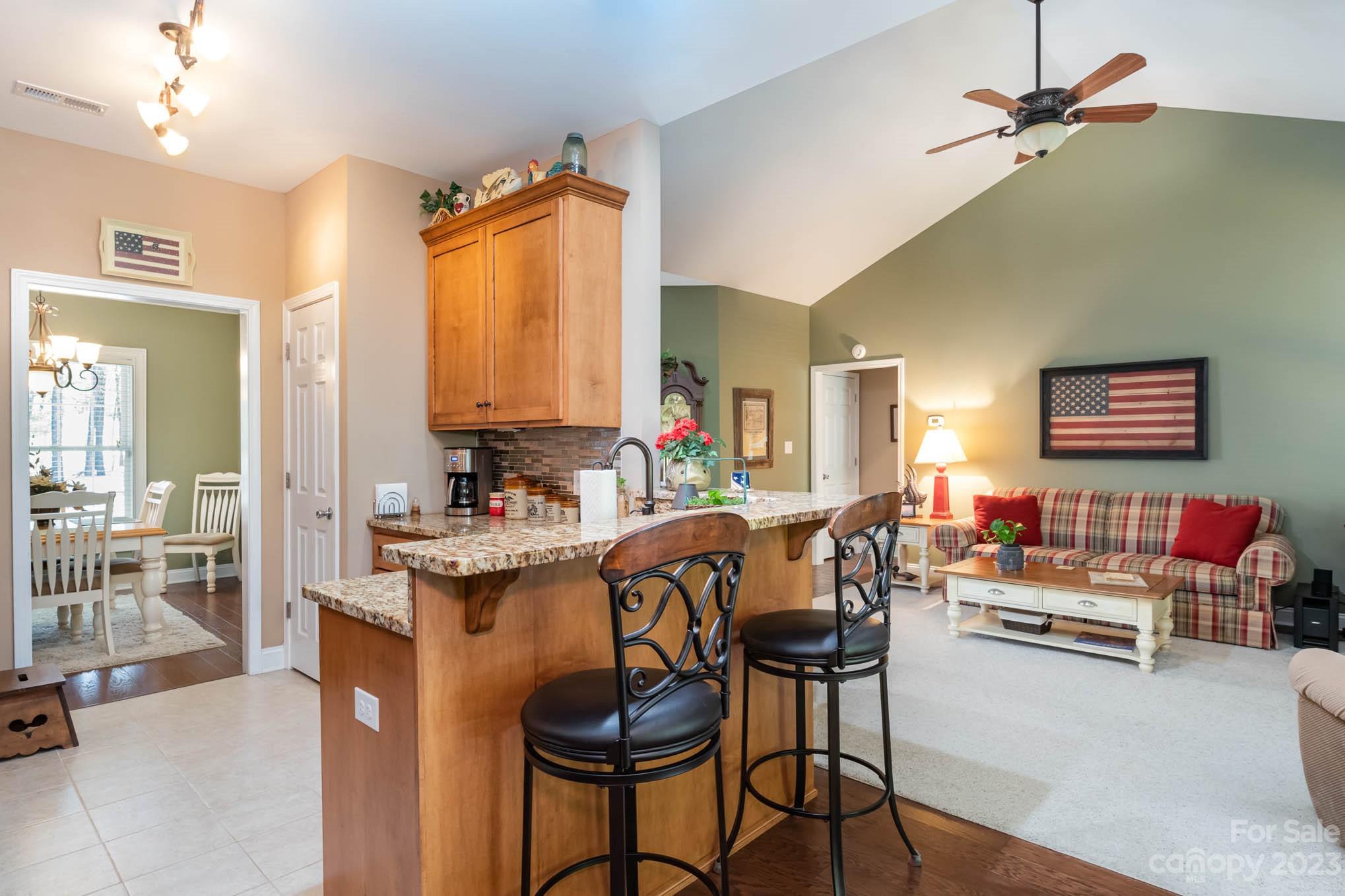 2255 South Paraham Road York, SC 29745 - Photo 9 of 33 a dining hall with stainless steel appliances a dining table and chairs with floor to ceiling window