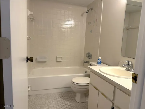a bathroom with a sink a toilet and a bathtub