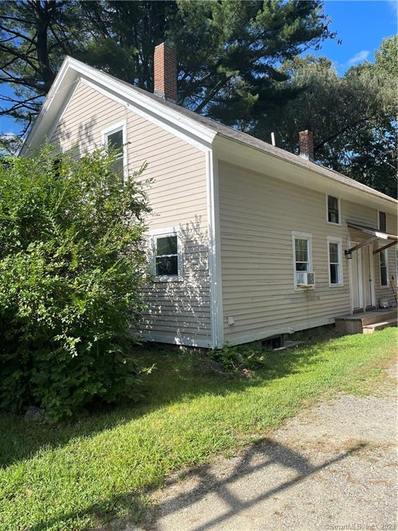 a view of a back yard of the house