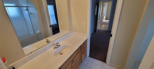 a bathroom with a tub and a sink