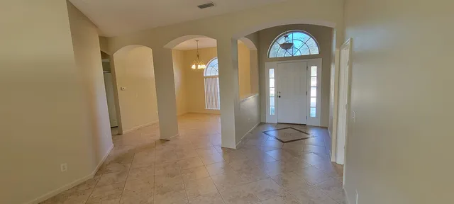 a view of livingroom with furniture and mirror