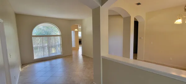 a view of entryway with kitchen