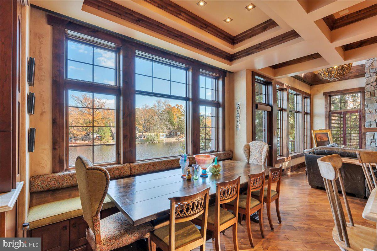 133 Stokes Road Medford Lakes, NJ 08055 - Photo 11 of 57 a dining room with furniture a chandelier and wooden floor
