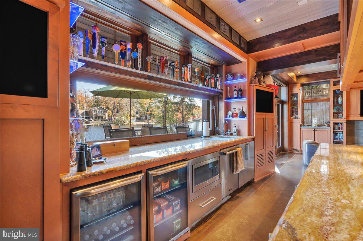 133 Stokes Road Medford Lakes, NJ 08055 - Photo 25 of 57 a kitchen with stainless steel appliances granite countertop a stove and a large window